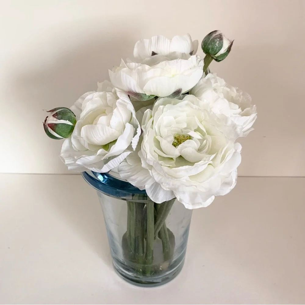 Thomas O’Brien Faux flowers in blue glass vase